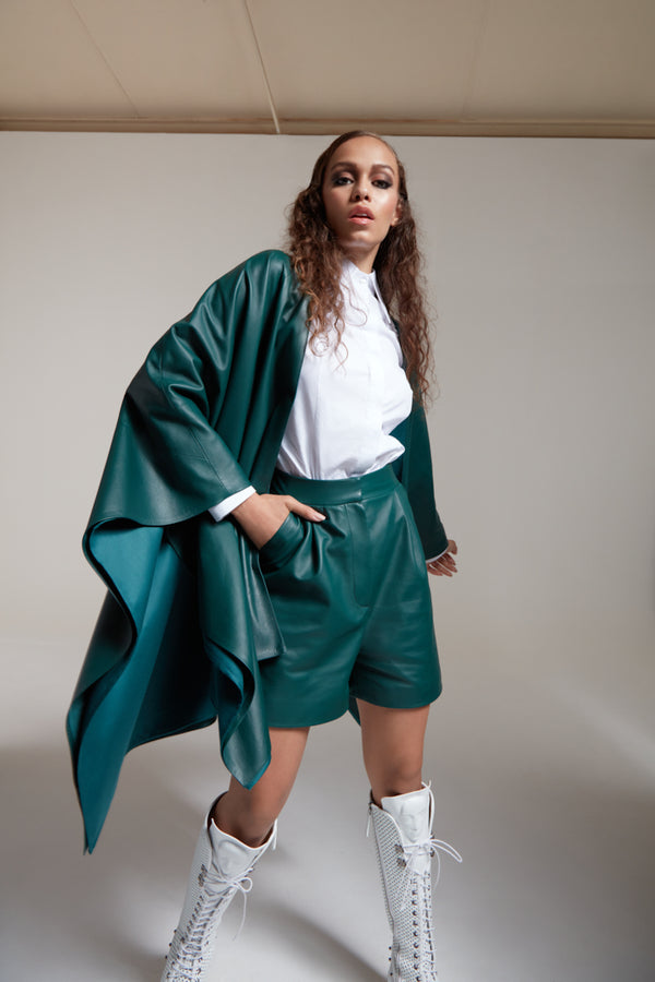 leather shorts in bottle green with leather poncho