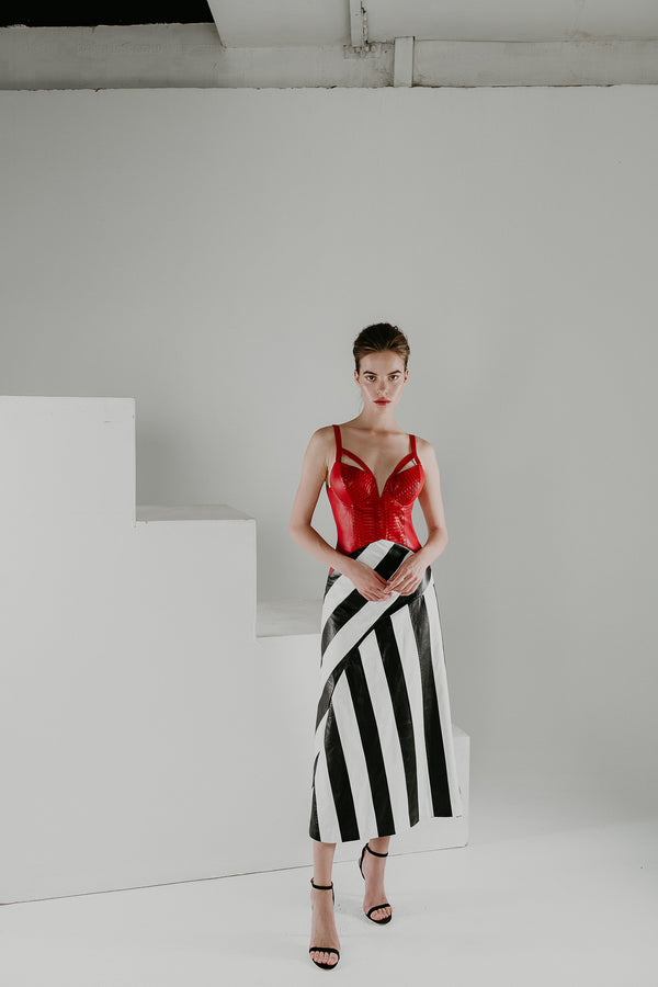 Drop waist leather dress in red and monochrome leather