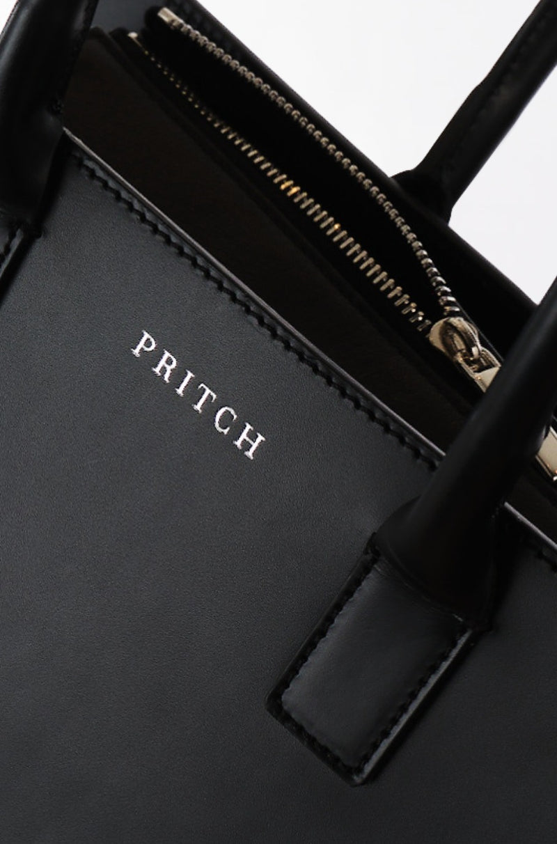 designer black soft leather tote bag close up
