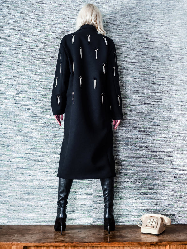 black thick wool coat with metal piercings and chains