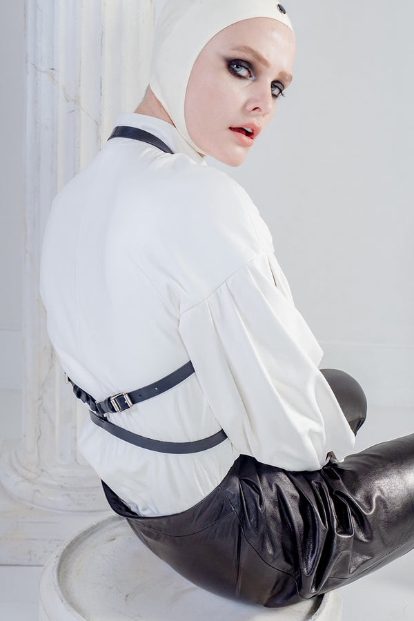 Black leather harness in white leather shirt 