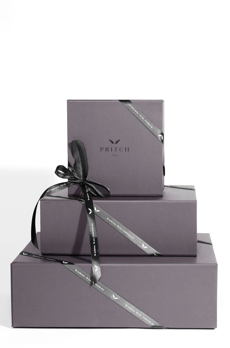 black packaging with black ribbon all black